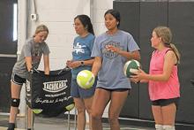 (ALEX HAVARDANSKY | THE GRAHAM LEADER) Mya Cabrera teaches Newcastle students how to serve at her group lessons Wednesday, July 9. On top of passing, Cabrera also said that forming a consistent arm swing is essential for individual and team success in the sport of volleyball. 