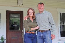 (THOMAS WALLNER | THE GRAHAM LEADER) Stephanie and Boone Campbell stand in front of their business Campbell Farm & Ranch on Elm Street in Graham. The company and Boone Campbell recently received multiple accolades for their work rural real estate industry.