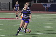 (ALEX HAVARDANSKY | THE GRAHAM LEADER) Adi Pinkston dribbles the ball to the side Monday, Jan. 12 against the Springtown Lady Porcupines. Pinkston scored the opening goal in the Lady Blues’ 5-0 victory. 