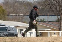 (THOMAS WALLNER | THE GRAHAM LEADER) A member of the Denton Fire Department bomb disposal team on scene at the Gateway Inn.