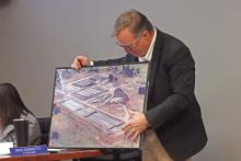 (ARCHIVE PHOTO | THE GRAHAM LEADER) City Manager Eric Garretty shows a photo of a portion of the wastewater treatment plant with the Graham City Council and community Jan. 23, 2025. During that meeting the city approved hiring Freese and Nichols as engineers to plan improvements at the facility.