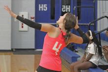 (ALEX HAVARDANSKY | THE GRAHAM LEADER) Hadleigh Allen takes a serve Tuesday, July 15 against the City View Lady Mustangs. Allen put the finishing touches on a Lady Blues 38-18 mercy rule win. 