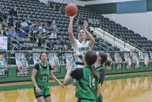(ALEX KIELAR | BRECKENRIDGE AMERICAN) Kenzie King lines up a shot Tuesday, Feb. 18 at the free throw line. The Ladycats achieved another victory Tuesday and moved to the regional finals Friday, Feb. 21.