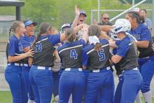 (ALEX HAVARDANSKY | THE GRAHAM LEADER) Zoey Harrell and her teammates celebrate triumphantly at home plate as they advance to the playoffs Friday, April 18. The teams kicks off their postseason schedule this week. 