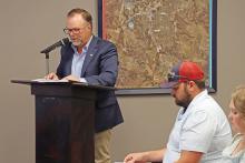 (THOMAS WALLNER | THE GRAHAM LEADER) City Manager Eric Garretty speaks at the Graham City Council meeting Thursday, July 18 regarding his reasoning for the increase in the property tax rate as well as the water and wastewater rates.