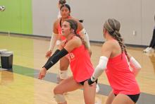 (ALEX HAVARDANSKY | THE GRAHAM LEADER) Braylee Wenninger resets a ball for her team Saturday, July 19. The Graham junior varsity Lady Blues went deep into the second day of tournament play and came just shy of the championship match.