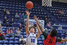 (THOMAS WALLNER | THE GRAHAM LEADER) Brodie Martin of the Steers jumps to put points on the board during the matchup Friday, Jan. 17 against the Mineral Wells Rams. Martin was a key player for the team during the match and has been an asset all season.