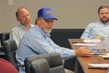 (THOMAS WALLNER | THE GRAHAM LEADER) City Manager Eric Garretty speaks to the Downtown Development District 1 board during their meeting Tuesday, Sept. 3. Shown from left to right are board member Brendan Weatherman, Garretty and Assistant City Manager Grant Ingram.