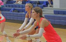 (ALEX HAVARDANSKY | THE GRAHAM LEADER) Kaden Atwood (center) and Tara Dawson prepare to defend a serve Tuesday, July 22. Coach Marci Faulk emphasized playing players in all different positions throughout the summer leagues. 