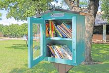 (THOMAS WALLNER | THE GRAHAM LEADER) A Little Free Library that is available outside the Library of Graham. The library is open to the community to take and donate books. 