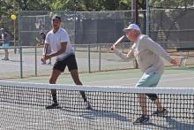 (THOMAS WALLNER | THE GRAHAM LEADER) Alexander Smith and Dr. Donald Behr play a game of pickleball Saturday, Aug. 3 at the Graham Country Club. The Young County Pickleball Association is looking for new members and those interested in trying out the sport through a pickleball clinic from 8 a.m. to noon Saturday, Aug. 17 at First Baptist Church in Graham.