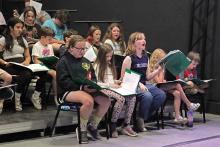 (THOMAS WALLNER | THE GRAHAM LEADER) Children playing munchkins in the Graham Regional Theatre production of ‘The Wizard of Oz’ practice singing at a rehearsal held Thursday, May 25 at The Perry theater in Graham.