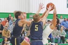 (ARCHIVE PHOTO | THE GRAHAM LEADER) Jacob Omundi fights to make a shot at the net at a game last season for the Bobcats. Omundi continues to be a force for the team this year.