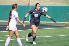 (ALEX HAVARDANSKY | THE GRAHAM LEADER) Taylor Lauster clears the ball to the Lubbock Liberty Patriots side of the field during their match up on Tuesday March, 25. Lauster accounted for seven defensive stops in the first half against Lubbock while also being a stabilizing force during the teams first round matchup against Borger.