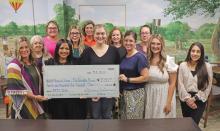 (THOMAS WALLNER | THE GRAHAM LEADER) Members of Virginia’s House accepted a $21,500 check from the Run for the Children board Tuesday, July 1 from proceeds raised from the run and auction. This year’s event celebrated 20 years in Graham, with over $230,000 raised since its establishment.