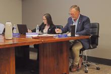 (THOMAS WALLNER | THE GRAHAM LEADER) City Manager Eric Garretty marks the votes made individually by the Graham City Council members for the adoption of a new tax rate. The council adopted a tax rate increase following a public hearing Monday, Sept. 9.
