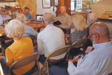 (THOMAS WALLNER | THE GRAHAM LEADER) Members of the audience listen to a presentation to the Young County Historical Commission from Vanessa Sims regarding a Historic Texas Cemetery medallion.