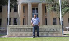 (THOMAS WALLNER | THE GRAHAM LEADER) Graham High School Principal Adam Anderson poses in front of the high school campus. Anderson started as the principal at the beginning of July and is looking forward to making connections with students, educators and the community.