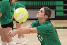 (ALEX HAVARDANSKY | THE GRAHAM LEADER) Newcastle’s Camren Mallory sets a ball at volleyball team camp Tuesday, July 29. Ladycats head coach Ashley Archer said fundamentals like setting were worked on heavily at two-a-day practices.