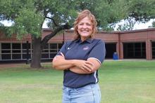 (THOMAS WALLNER | THE GRAHAM LEADER) Woodland Elementary School Principal Jamie West poses in front of the campus. Her first day in the principal position was last week, but West is already looking to the future for growth, both for herself and the campus as a whole.