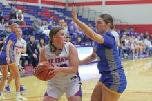 (LIAM BAILEY | THE GRAHAM LEADER) Addyson Weaver looks for an open teammate while being blocked by a Brock defender Tuesday, Jan. 28. While the team improved it is rematch against Brock, it fell 26-46 in the home matchup.