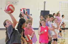 (ALEX HAVARDANSKY | THE GRAHAM LEADER) Lady Blues sixth and seventh grade campers work on their serving form during volleyball camp Tuesday, July 29. Volleyball head coach Marci Faulk said that the younger grade athletes worked on more basic skills like correct serving form. 