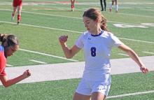 (ALEX HAVARDANSKY | THE GRAHAM LEADER) Lexi Enns fights the ball away from a defender Monday, Jan. 19 against the Abilene Cooper Lady Cougars. The Lady Blues defense remained stout throughout the contest in a 0-0 tie.