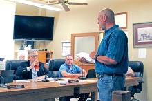 (ARCHIVE PHOTO | THE GRAHAM LEADER) Graham Area TxDOT Engineer Zach Husen speaks in June 2024 with the Young County Commissioners Court about a national grant to aid in roads and bridges improvement projects.