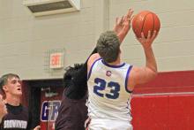 (ALEX HAVARDANSKY | THE GRAHAM LEADER) Thomason Burkett puts the ball up for a layup Tuesday, Jan. 20 against the Brownwood Lions. Burkett put up seven points in the Steers 59-35 win.