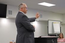 (THOMAS WALLNER | THE GRAHAM LEADER) Assistant Superintendent Robert Loomis speaks Wednesday, Aug. 6 with the Graham ISD Board of Trustees regarding the in-progress Student Code of Conduct. Within that document will be a new personal communication device policy in line with state law.