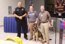 (TC GORDON | THE GRAHAM LEADER) The Graham Noon Lions Club donated a lifesaving vest to the Graham Police Department for K9 officer Wolf. From left to right are Graham Police Chief Brent Bullock, Sergeant Hailey Calcote, Wolf and Lions Club member Darren Helm.
