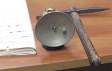 (ALEX HAVARDANSKY | THE GRAHAM LEADER) A carbide lantern and pick axe displayed at the Young County Museum of History and Culture. The lantern was donated by Carl Birdwell. 
