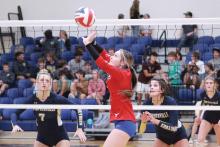 (TC GORDON | THE GRAHAM LEADER) Junior Camden Thorne prepares to set the ball for one of her teammates during Graham’s regular-season finale Tuesday, Oct. 24 with Stephenville. The Lady Blues ultimately lost in three sets to the Honeybees and will begin their playoff run Monday, Oct. 30.