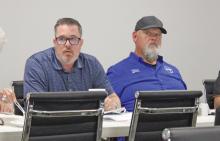 (ALEX HAVARDANSKY | THE GRAHAM LEADER) Jared Brown sits in on the monthly hospital board meeting Thursday, July 31 at GRMC. Brown serves as the Chief Financial Officer at the hospital. Shown left to right are Brown and EMS Director Bobby Hadderton.