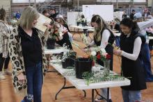(ARCHIVE PHOTO | THE GRAHAM LEADER) Judges for the Floral Design competition inspected and took note of participants throughout the process in addition to their final result during the County Fair in January 2024. The competition this year will be held Thursday, Jan. 16 at the Young County Arena. 