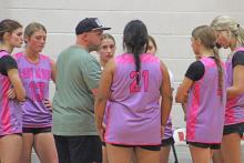 (ALEX HAVARDANSKY | THE GRAHAM LEADER) The Lady Blues discussed game strategy with head coach Brian Nail in their matchup Thursday, May 1 against the Huckabay Lady Indians. Nail said after the game that he liked the fight his team showed throughout the night.