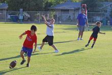 (ARCHIVE PHOTO | THE GRAHAM LEADER) Youth run drills in a football camp held in 2022 for Graham High School. The high school is hosting another football camp this month From July 28-30 for elementary through 9th grade participants.