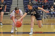 (ALEX HAVARDANSKY | THE GRAHAM LEADER) Addyson Weaver dives for a ball Friday, Jan. 30 against the Stephenville Honeybees. Weaver was effective at driving inside the arc and hitting close proximity shots in the Lady Blues matchup. 