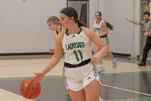 (ALEX HAVARDANSKY | THE GRAHAM LEADER) Emma Hawkins takes the offense down the court Saturday, Jan. 31 against the Throckmorton Lady Greyhounds. Hawkins took over offensively in the third quarter of the Ladycats 41-13 win. 