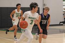 (ALEX HAVARDANSKY | THE GRAHAM LEADER) Keyton Newland pushes the offense up the floor Saturday, Jan. 31 against the Throckmorton Greyhounds. Newland scored 21 points in the Bobcats 73-14 victory. 
