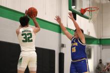 (ALEX HAVARDANSKY | THE GRAHAM LEADER) London Martinez passes the ball to a teammate Tuesday, Feb. 3 against the Bryson Cowboys. The Bobcats showed their grit in their 47-31 victory over the Cowboys to pull off consecutive wins at home. 