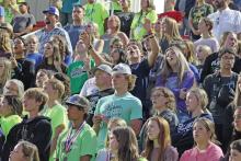 (FILE PHOTO | THE GRAHAM LEADER) Visitors to the 2022 Fields of Faith event sing in the audience at Newton Field. The event this year will be held Wednesday, Oct. 11.