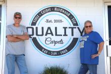 (THOMAS WALLNER | THE GRAHAM LEADER) Herbert and Marla Lee pose in front of their business Quality Carpets on Fourth Street which celebrated its 20th anniversary this week. The couple is thankful for the community’s support over the years to make their dream a reality.