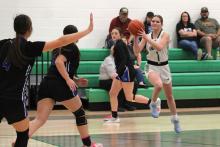 (ALEX HAVARDANSKY | THE GRAHAM LEADER) Camren Mallory throws a jump pass in one of the Ladycats’ previous matchups. The Ladycats fought hard in their bi-district matchup Monday, Feb. 16 against Saint Jo but lost a thriller 29-27. 