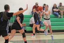 (ALEX HAVARDANSKY | THE GRAHAM LEADER) Camren Mallory jumps for a pass Friday, Feb. 6 against Garner, Mallory was a key scorer in the Ladycats 36-22 victory on senior night. 