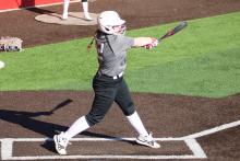 (ALEX HAVARDANSKY | THE GRAHAM LEADER)  Kloe Hammond swings at a ball Saturday, Feb. 7 against the Jacksboro Tigerettes. The Lady Blues hosted a home scrimmage against the Tigerettes in preparation for the regular season. 