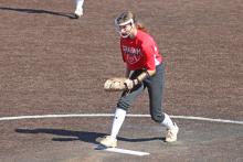 (ALEX HAVARDANSKY | THE GRAHAM LEADER) Tiffany Cotter prepares to throw a pitch Saturday, Feb. 7 in a scrimmage match. Cotter was strong at the pitcher’s mound only allowing one run against the Jacksboro Tigerettes.
