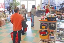 (THOMAS WALLNER | THE GRAHAM LEADER) Visitors to the Nifty Thrifty thrift store in Graham check out Tuesday, Dec. 19 at the counter. The store is one of the organizations which makes up the Graham Crisis Center and what helps to fund its efforts.