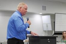(THOMAS WALLNER | THE GRAHAM LEADER) Graham ISD Assistant Superintendent of Finance and Operations Gary Browning speaks to the GISD Board of Trustees about the Teacher Incentive Allotment budget amendment on the Wednesday, May 14 agenda. The allotment provided an additional $556,710 in funds for teachers locally.