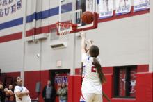 (ALEX HAVARDANSKY | THE GRAHAM LEADER) Katy McGehee shoots a three pointer Tuesday, Feb. 10 against the Mineral Wells Lady Rams. McGehee was effective at getting to the basket in the Lady Blues’ 45-35 win.